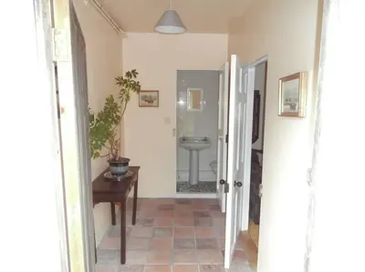a hallway with a bathroom with a sink and a toilet at Threecrofts Farm in Dumfries