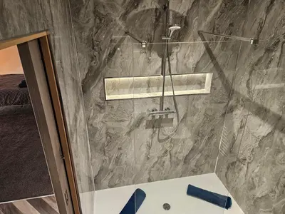 a shower with a glass door in a bathroom at Carlisle City Centre The Wash House in Carlisle
