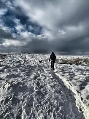 a person is cross country skiing in the snow at A charming luxury apartment! in Portinscale