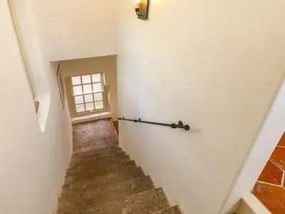 a staircase in a house with a window at The Pavillion in Carlisle