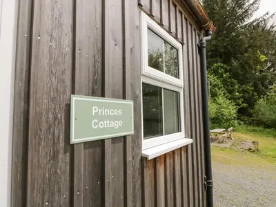 a sign on the side of a building at Prince's Cottage in Thornhill