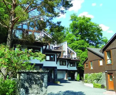 a house with a balcony on the side of it at Keswick Bridge 19, within walking distance of Keswick town centre, strictly no pets in Keswick