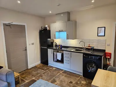 a kitchen with a black refrigerator and a dishwasher at Carlisle City Centre The Gavel in Carlisle