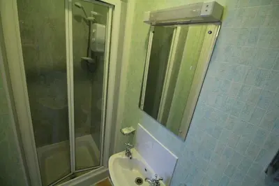a bathroom with a sink and a shower at Bluestones in Keswick
