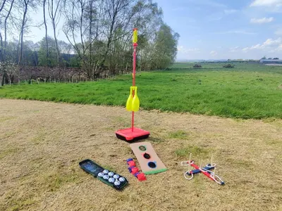 a miniature game on the ground with tools in a field at Criffel Cottage in Ruthwell