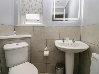 a bathroom with a toilet and a sink at Castle Crag in Keswick