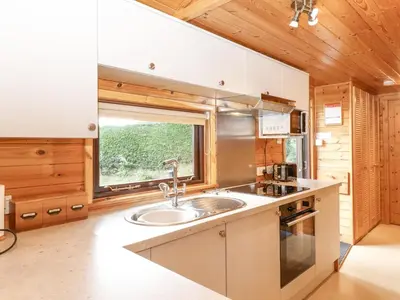 a kitchen with a sink and a window at Ennerdale Lodge in Keswick