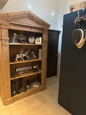 a room with a black refrigerator and a shelf at Bonshaw Grange-Riverside Country Retreat, & HotTub in Lockerbie