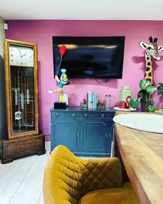 a room with a tv and a giraffe on a wall at Bonshaw Grange-Riverside Country Retreat, & HotTub in Lockerbie