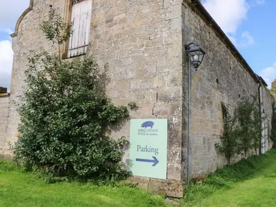 a sign on the side of a brick building at The Courtyard in Carlisle