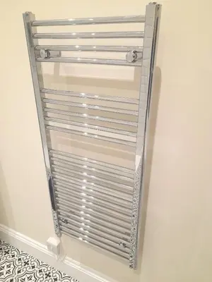 a metal towel rack hanging on a wall at Kirkcudbright Holiday Apartments - Apartment D in Kirkcudbright