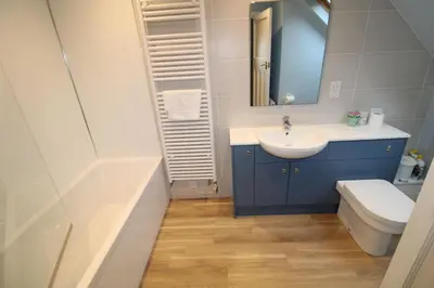 a bathroom with a sink and a toilet and a tub at Hill Cottage, Braithwaite with garden and fell views, dog friendly walks from the door, close to Bassenthwaite in Braithwaite