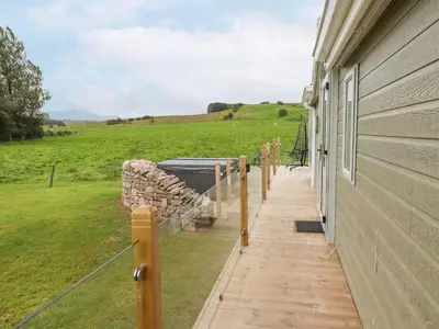 a porch of a house with a view of a field at No 7 Skiddaw View in Cockermouth