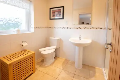 a bathroom with a toilet and a sink at Spedding Fold Chapel Stile in Chapel Stile
