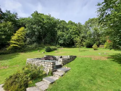 a stone wall in the middle of a field at Spedding Fold Chapel Stile in Chapel Stile