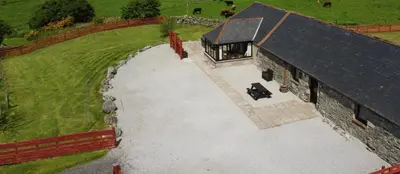 an overhead view of a house with a driveway at Middle Byre at Clauchan Holiday Cottages in Gatehouse of Fleet