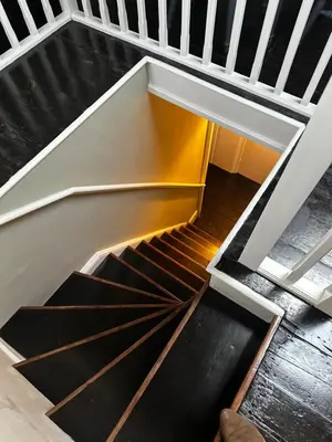 an overhead view of a spiral staircase in a house at Penthouse apartment in Cockermouth