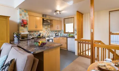 a kitchen with a counter top in a room at Keswick Bridge Lodge Resort in Keswick