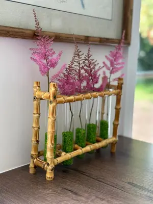 a wooden plant stand with purple flowers and green plants at Oak View Lodge: Cosy, Countryside Retreat in Maybole