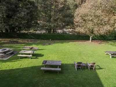 a group of picnic tables and chairs in a park at Apartment 2 in Keswick