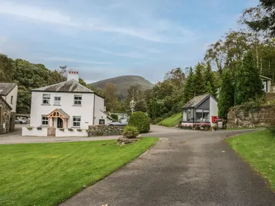 a house on a road in a village at Apartment 2 in Keswick