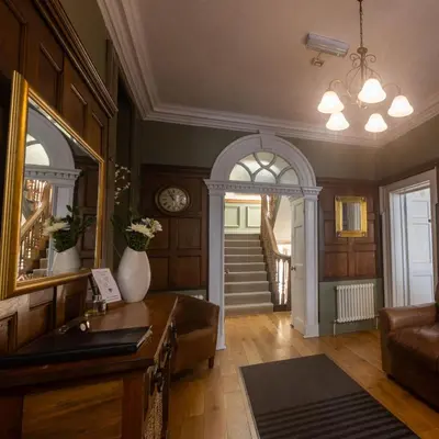 a living room with a sink and a hallway at CastlegateTownhouse in Cockermouth