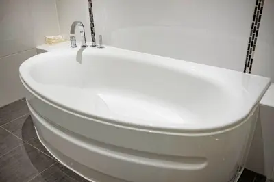 a white toilet in a bathroom with a sink at OPUL EXPRESS - Inglewood in Douglas