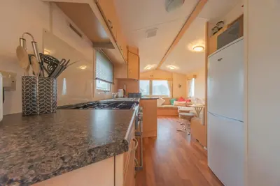 a kitchen with a counter top and a stove top oven at Newton Stewart-Sleeps 6-Pool-Parking-Pet Friendly in Newton Stewart