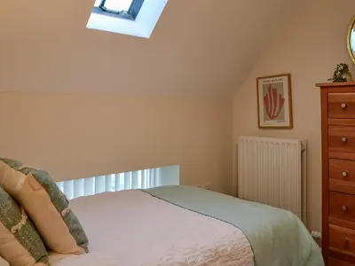 a bedroom with a bed and a skylight at The Police Station - Uk45642 in Silloth