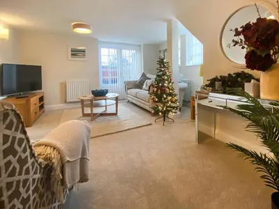 a living room with a christmas tree and a couch at The Police Station - Uk45642 in Silloth