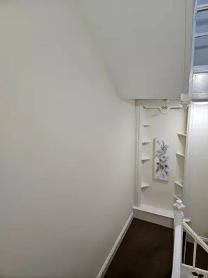 a room with white walls and white shelves at Carlisle City Centre. Spacious Apartment. Ideal location. in Carlisle