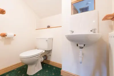a bathroom with a toilet and a sink at 2 Bed in Threlkeld SZ134 in Threlkeld