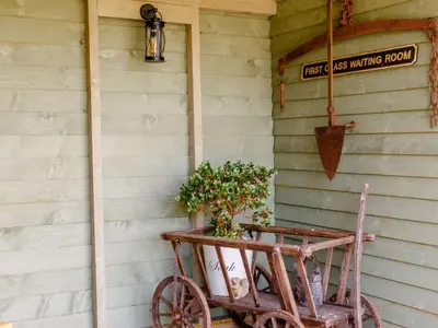 an old cart with a plant in it next to a wall at 1 Bed in Easton 56742 in Kirklinton
