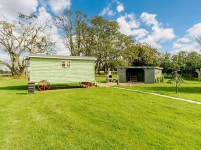 a small green shed in a grassy field at 1 Bed in Easton 56742 in Kirklinton