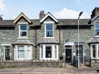 an old brick house with white windows at 2 bed in Keswick 87732 in Keswick
