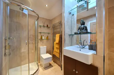 a bathroom with a sink and a shower and a toilet at The Lemon Tree in Prestwick