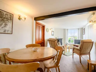a living room with a wooden table and chairs at 1 Bed in Eskdale SZ503 in Beckfoot