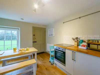 a kitchen with a counter and a stove top oven at 2 Bed in High Lorton 86023 in Lorton