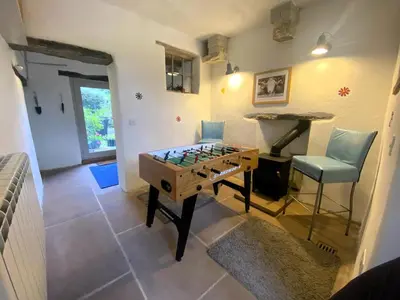 a room with a foosball table and a chair at 2 Bed in High Lorton 86023 in Lorton