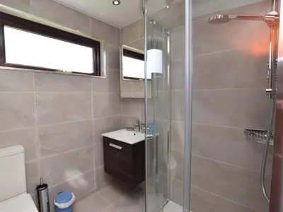 a bathroom with a shower and a sink at 2 Bed in Isle of Whithorn 77880 in Isle of Whithorn