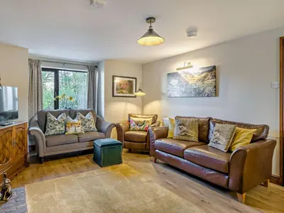 a living room with two couches and a tv at 5 Bed in Cleator oc-sz529 in Ennerdale Bridge
