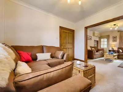 a living room with a couch and a table at 3 Bed in Ennerdale Bridge SZ392 in Ennerdale Bridge