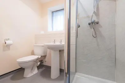 a bathroom with a toilet and a sink and a shower at 3 Bed in Threlkeld SZ433 in Threlkeld