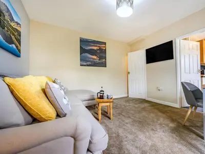a living room with a couch and a tv at 2 Bed in Cockermouth oc-87481 in Cockermouth