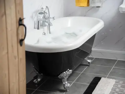 a black and white bath tub in a bathroom at 2 Bed in Mawbray SZ214 in Mawbray
