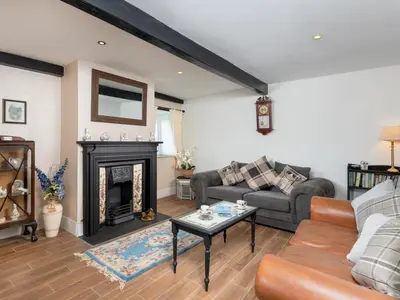 a living room with a couch and a fireplace at 2 Bed in Mawbray SZ214 in Mawbray