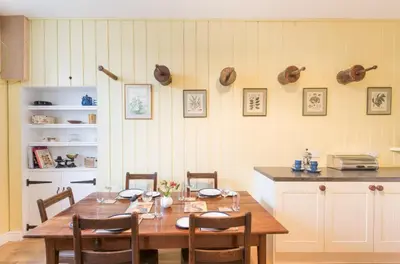a dining room with a wooden table and chairs at 2 Bed in Boltongate SZ396 in Mealsgate