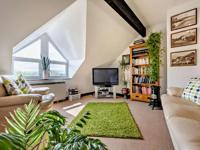 a living room with a couch and a tv at 4 Bed in Troutbeck nr Ullswater SZ256 in Troutbeck