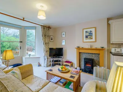 a living room with a couch and a fireplace at 1 bed property in Keswick 86117 in Braithwaite
