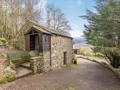 an old stone house with a driveway at 2 Bed in Wasdale Head SZ053 in Nether Wasdale